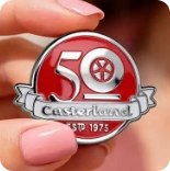 50th anniversary pin held in hand